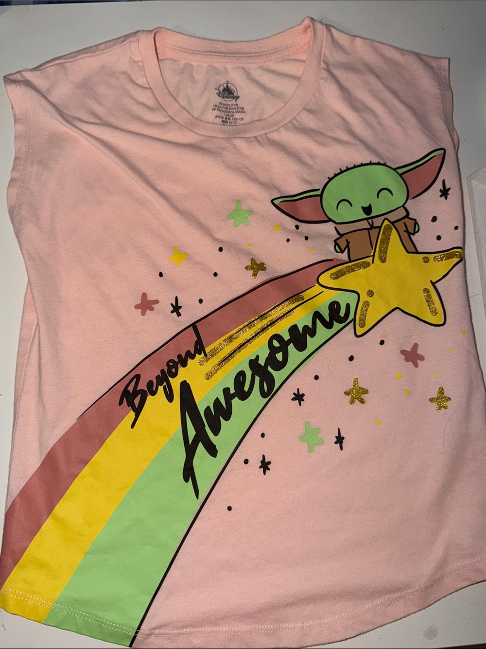 Disney Store Star Wars t-shirt features a graphic of Grogu (Baby Yoda) Girls 7/8